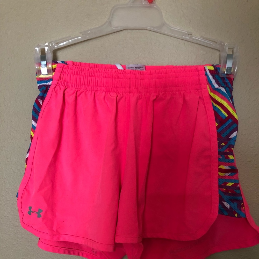 Bright pink Under Armour athletic shorts